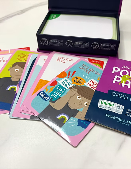 A box of cards featuring an image of a person on the front, showcasing a colorful design and clear text.